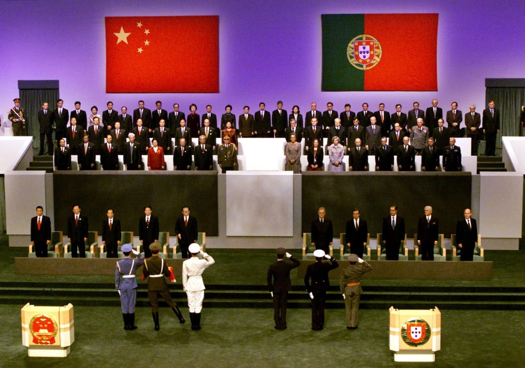 The Chinese (left) and Portuguese guards of honour salute national leaders at the Macau handover ceremony on December 19, 1999. Photo: AFP