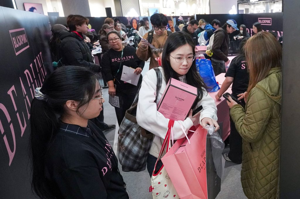 Fans snap up merchandise ahead of the girl group’s shows in Hong Kong. Photo: Karma Lo