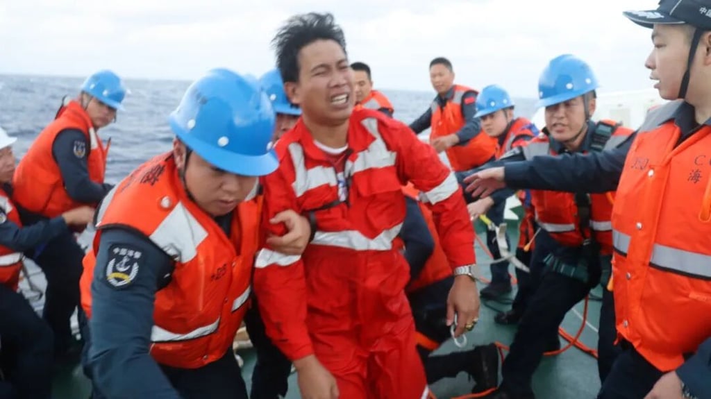 Some members of a Singapore-flagged cargo ship are rescued by Chinese coastguard crew near the disputed Scarborough Shoal on Friday. Photo: China Coast Guard