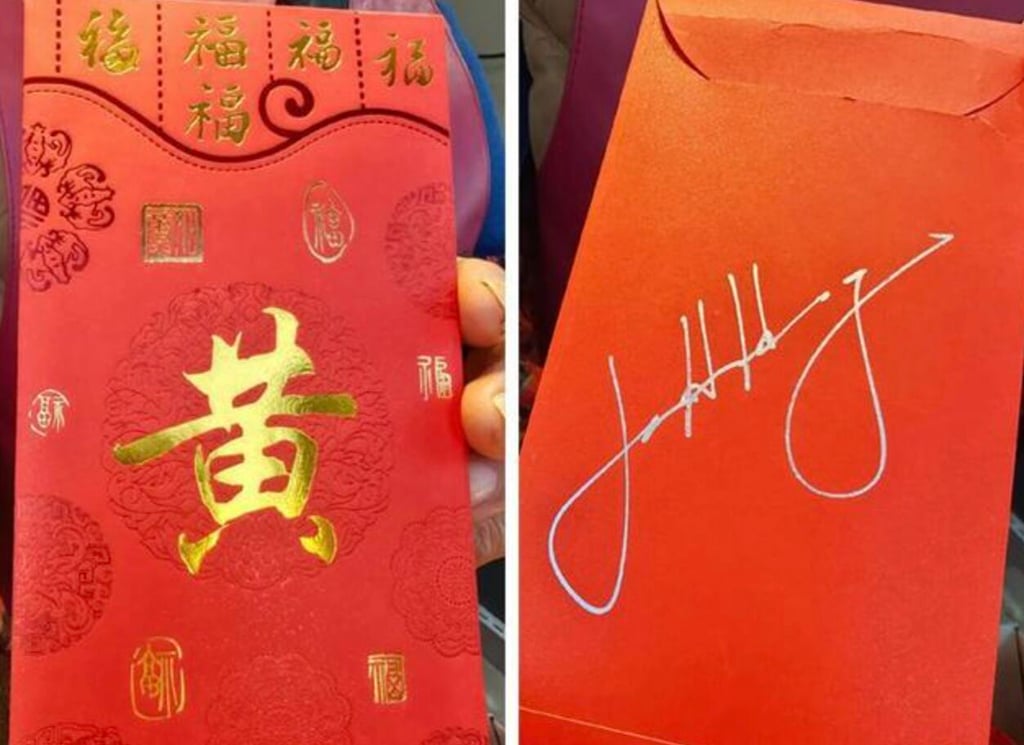 One of the market vendors shows off the lai see she received from Jensen Huang. Photo: Jimu