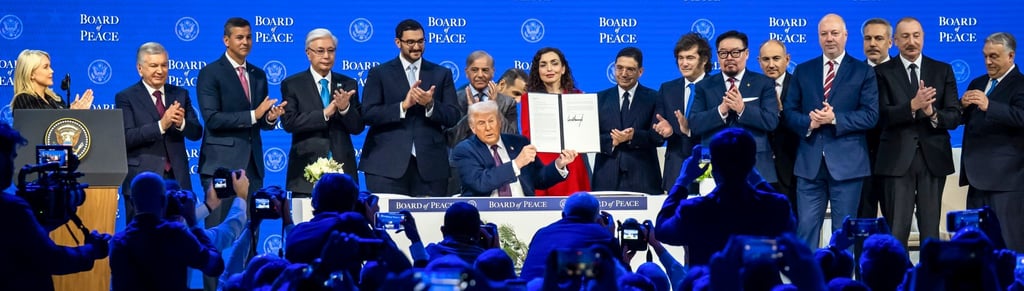 US President Donald Trump holds up the signed “Board of Peace” charter on Thursday. Photo: EPA US President Donald Trump holds up the signed “Board of Peace” charter on Thursday. Photo: EPA