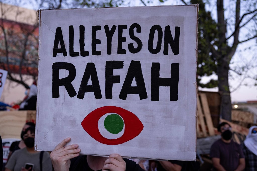 Demonstrators hold signs as they protest during a rally in support of Rafah in Los Angeles, California, in May 2024. Photo: AFP