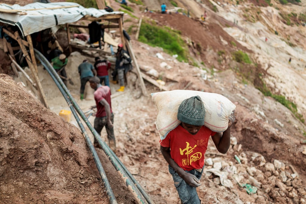A labourer carries a sack of ore at a coltan mine in the town of Rubaya - controlled by M23 rebels - in the DRC in March 2025. Photo: Reuters