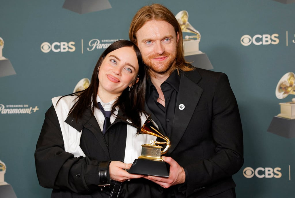 Billie Eilish and her brother Finneas, both wearing ICE Out badges, with the award for song of the year for “Wildflower” at the 68th Annual Grammy Awards in Los Angeles, California. Photo: Reuters
