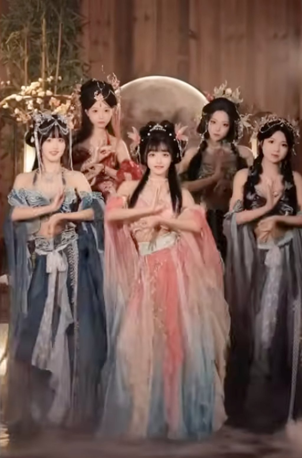 A group of live-streaming dancers dressed in silky traditional-style costumes. Photo: YouTube
