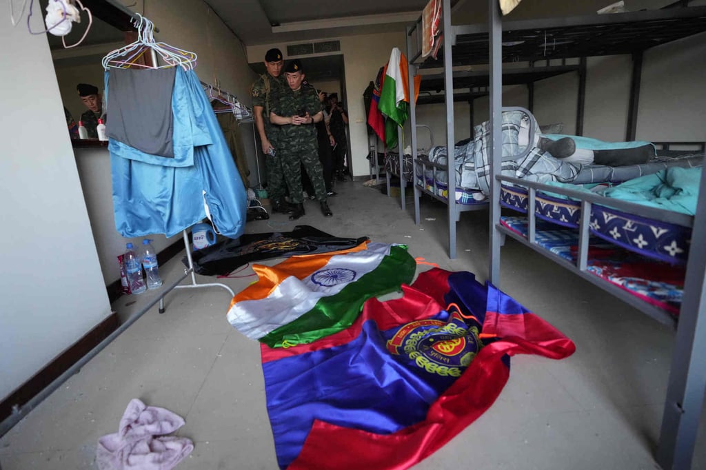 Thai soldiers inspect an abandoned bedroom at the scam centre in O’Smach, Cambodia, on Monday. Photo: AP Thai soldiers inspect an abandoned bedroom at the scam centre in O’Smach, Cambodia, on Monday. Photo: AP