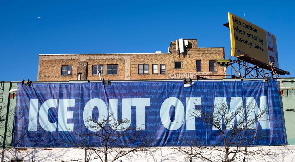 A banner reading “ICE OUT OF MN” hangs on the side of Wrecktangle Pizza on Monday. Photo: Getty Images via AFP