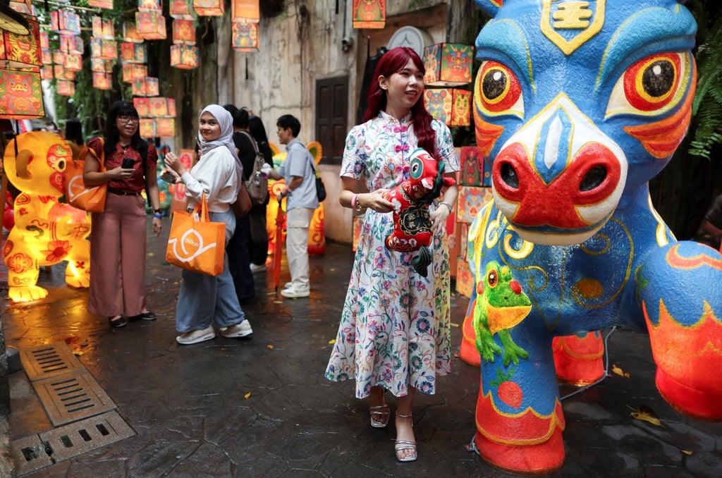 People admire statues representing animals of the Chinese zodiac at the “Guardians of Legacy” installation for the Lunar New Year in Kuala Lumpur, Malaysia, last month. Photo: Reuters