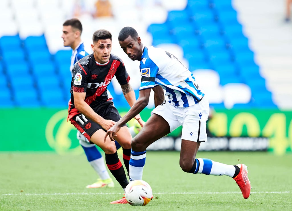 Martin Merquelanz (left) shadows Alexander Isak of Real Sociedad while playing for Rayo Vallecano in a La Liga match in 2021. Photo: Getty Images