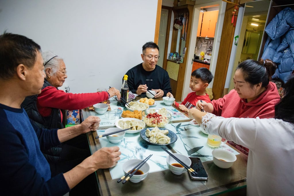 Chinese family members gather and spend time together by making traditional dishes on Lunar New Year’s Eve in Beijing. Photo: Getty Images