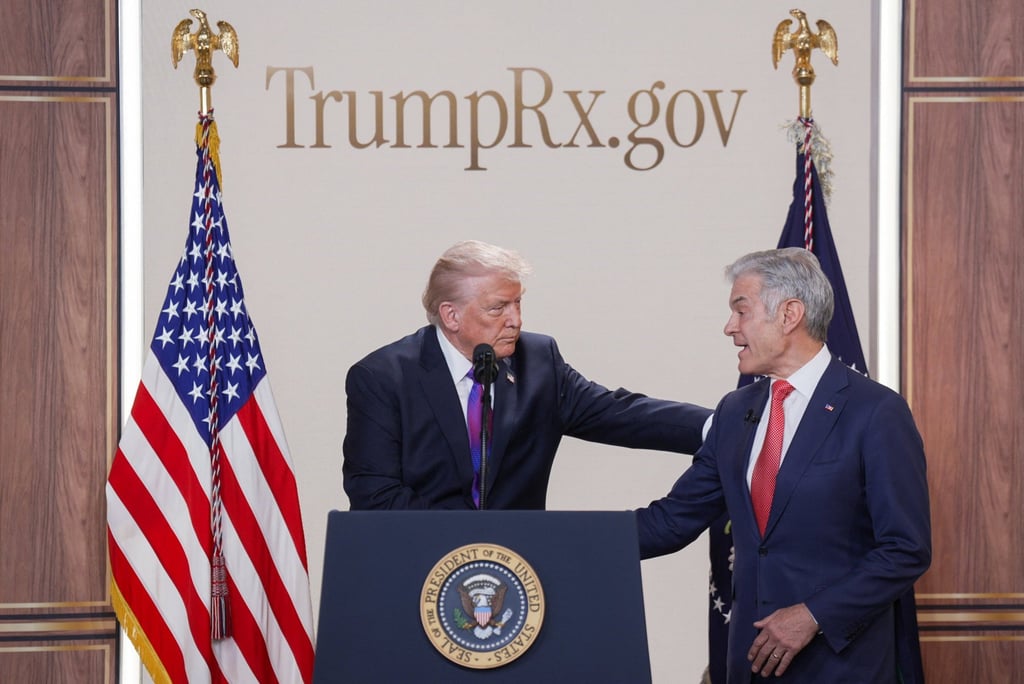 US President Donald Trump and Dr Mehmet Oz. Photo: Reuters