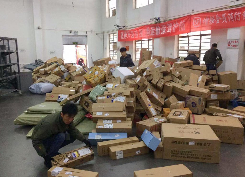 Hu Anyan sorts parcels during his days working as a courier in Beijing, China. Photo: courtesy Hu Anyan