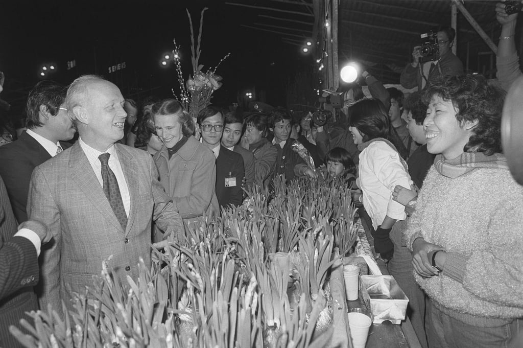 Governor Sir Edward Youde and Lady Youde visit the Lunar New Year flower market at Victoria Park in 1984. Photo: SCMP Archives