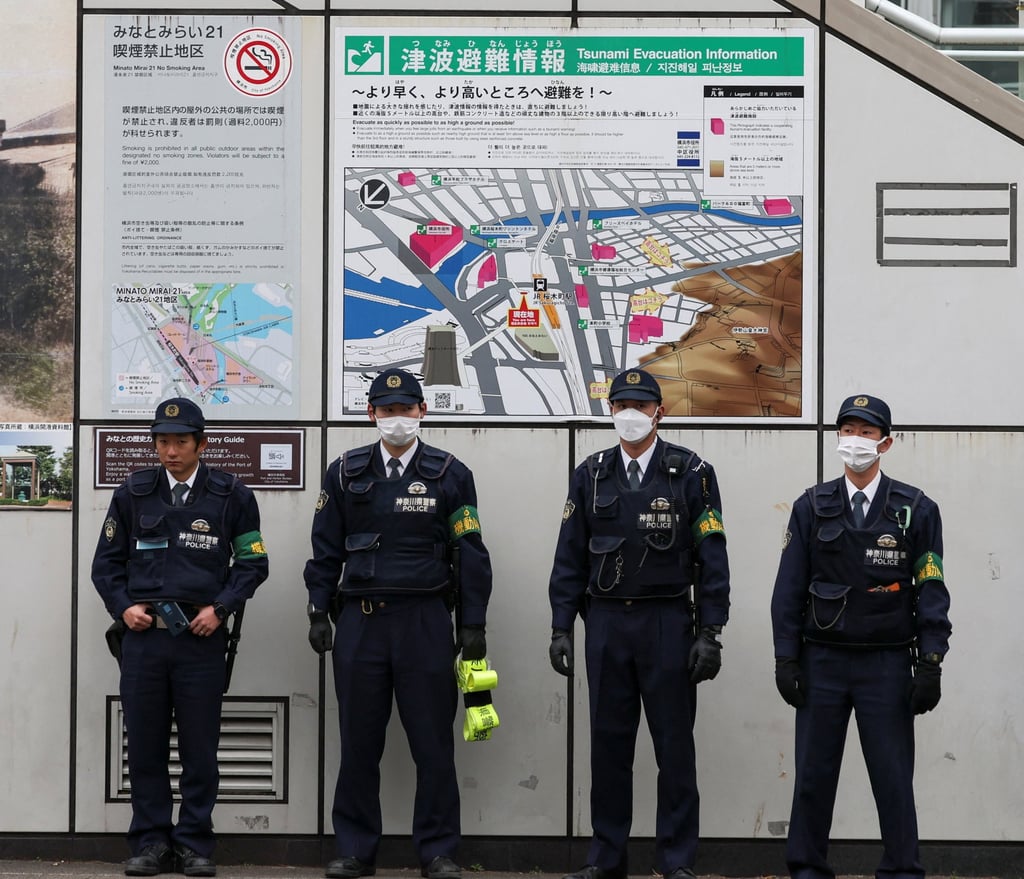 Police officers stand guard during Japan’s Centrist Reform Alliance co-leader Yoshihiko Noda’s election campaign event on January 28. Photo: Reuters