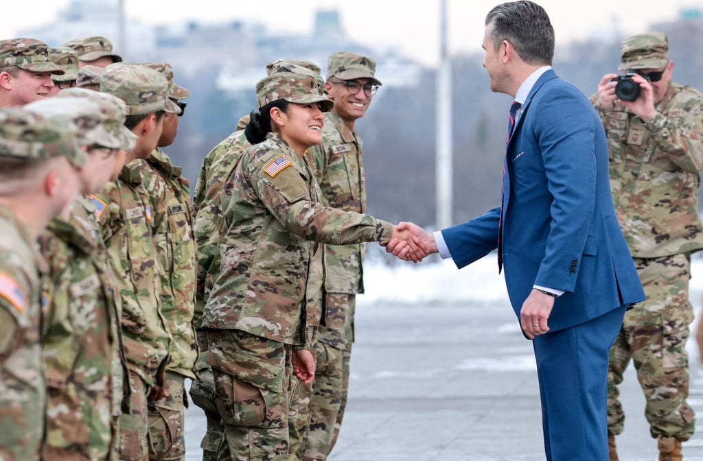 US Defence Secretary Pete Hegseth greets Army National Guard soldiers after administering their oath during a re-enlistment ceremony at the base of the Washington Monument on Friday. Photo: Reuters US Defence Secretary Pete Hegseth greets Army National Guard soldiers after administering their oath during a re-enlistment ceremony at the base of the Washington Monument on Friday. Photo: Reuters