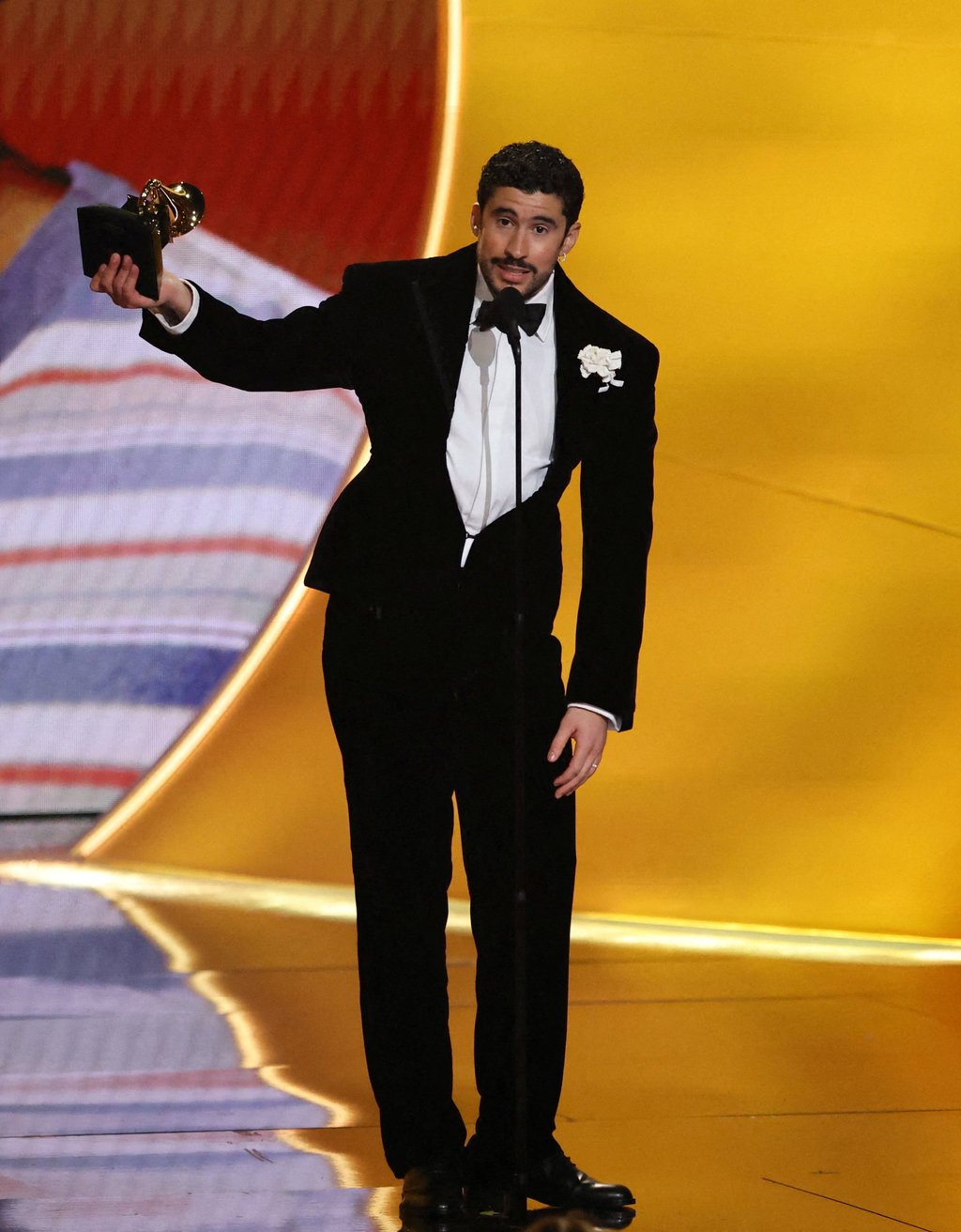 Bad Bunny accepts the award for album of the year for Debí Tirar Más Fotos, in Los Angeles, on February 1. Photo: Reuters/TPX Bad Bunny accepts the award for album of the year for Debí Tirar Más Fotos, in Los Angeles, on February 1. Photo: Reuters/TPX