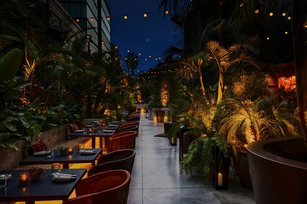Outdoor seating in a lush garden at Ka’teen. Photo: Handout