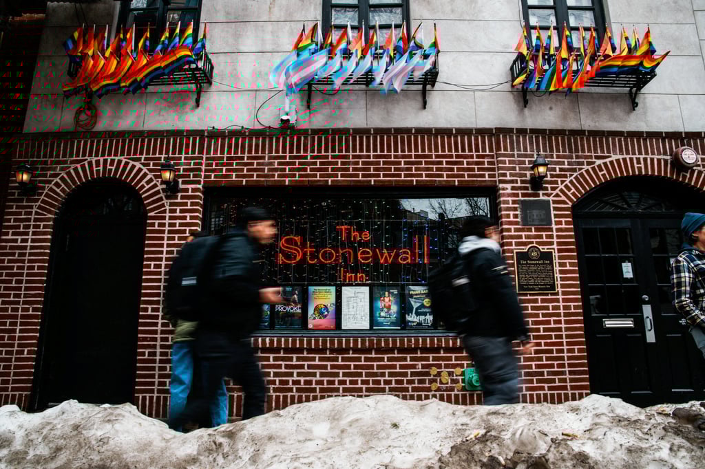 People walk past The Stonewall Inn on Tuesday, after authorities removed the Pride flag from the Greenwich Village site of the Stonewall National Monument. Photo: Reuters People walk past The Stonewall Inn on Tuesday, after authorities removed the Pride flag from the Greenwich Village site of the Stonewall National Monument. Photo: Reuters