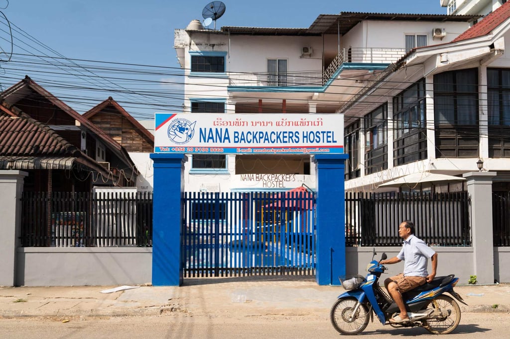 A motorcyclist passes the Nana Backpackers Hostel in Vang Vieng, Laos, in November 2024. Photo: AFP