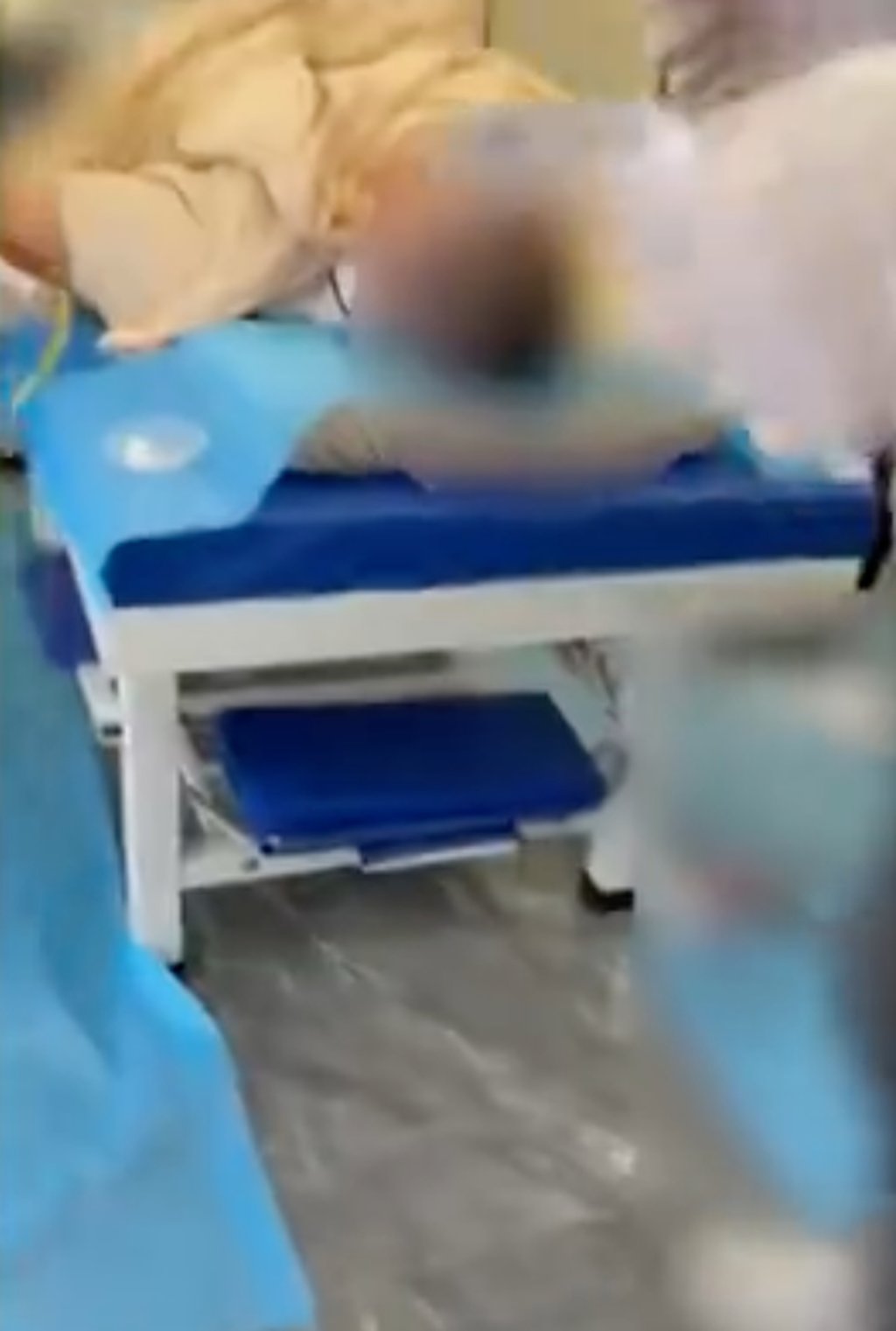 The male patient, above, is seen lying on a bed before the procedure began. Photo: Weibo