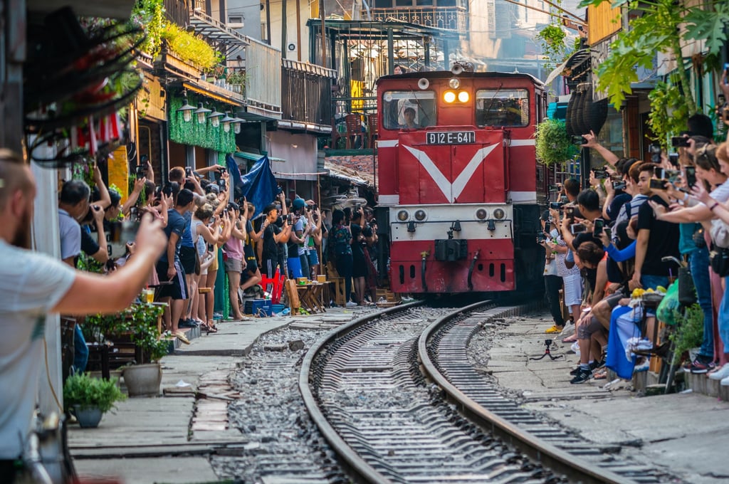 View of train passing through a narrow street of the Hanoi Old Quarter - a popular tourist attraction. Photo: Shutterstock
