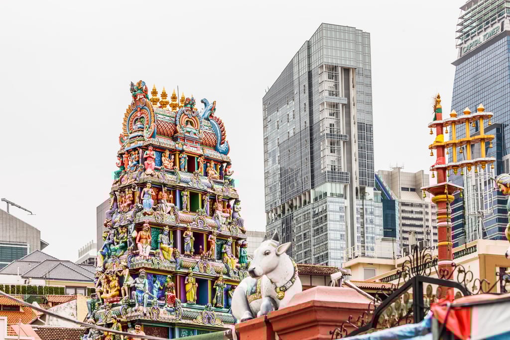 The decorated roof of the Sri Mariamman Temple is seen in Singapore’s Chinatown. The temple sits between a mosque and a Chinese Buddhist temple, with a Christian church located a little further down the road. Photo: Getty Images