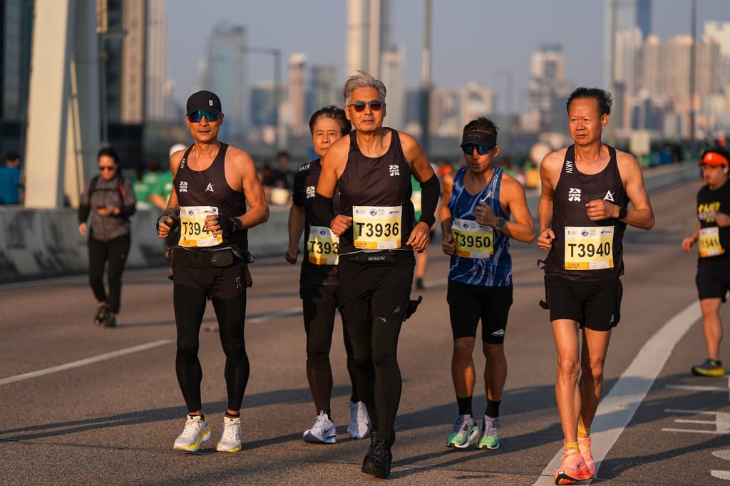Actor Chow Yun-fat (middle) runs in the 10km event at the Standard Chartered Hong Kong Marathon 2026. The 70-year-old is part of a growing number of older people competing in endurance races. Photo: Eugene Lee Actor Chow Yun-fat (middle) runs in the 10km event at the Standard Chartered Hong Kong Marathon 2026. The 70-year-old is part of a growing number of older people competing in endurance races. Photo: Eugene Lee
