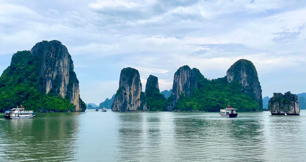 Tourist boats sail through the world-famous waterscape of Halong Bay. Photo: dpa