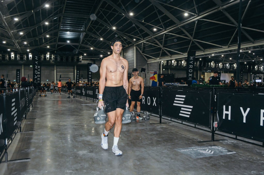 Payet carries kettlebells during a Hyrox competition in Singapore in November 2025. Photo: Ben Payet Payet carries kettlebells during a Hyrox competition in Singapore in November 2025. Photo: Ben Payet