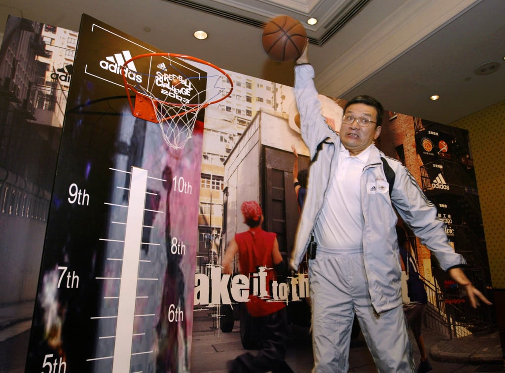 Norman Chan mimics a slam dunk during a press conference in 2003. Photo: Dustin Shum