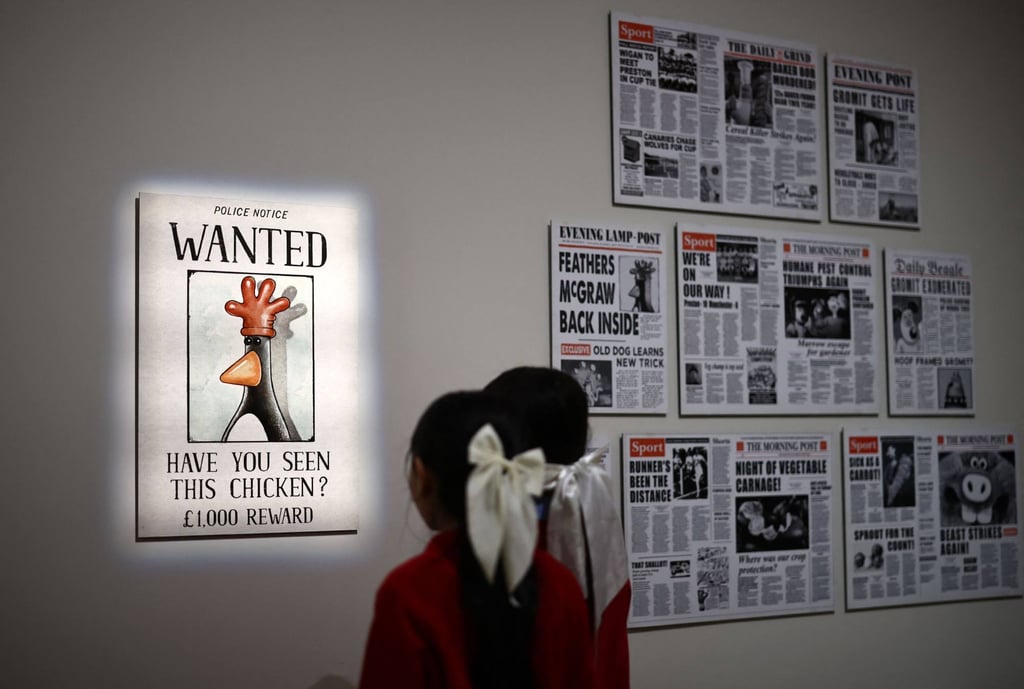 A Wanted poster for the Wallace & Gromit character Feathers McGraw, at the “Inside Aardman: Wallace & Gromit and Friends” exhibition. Photo: AFP