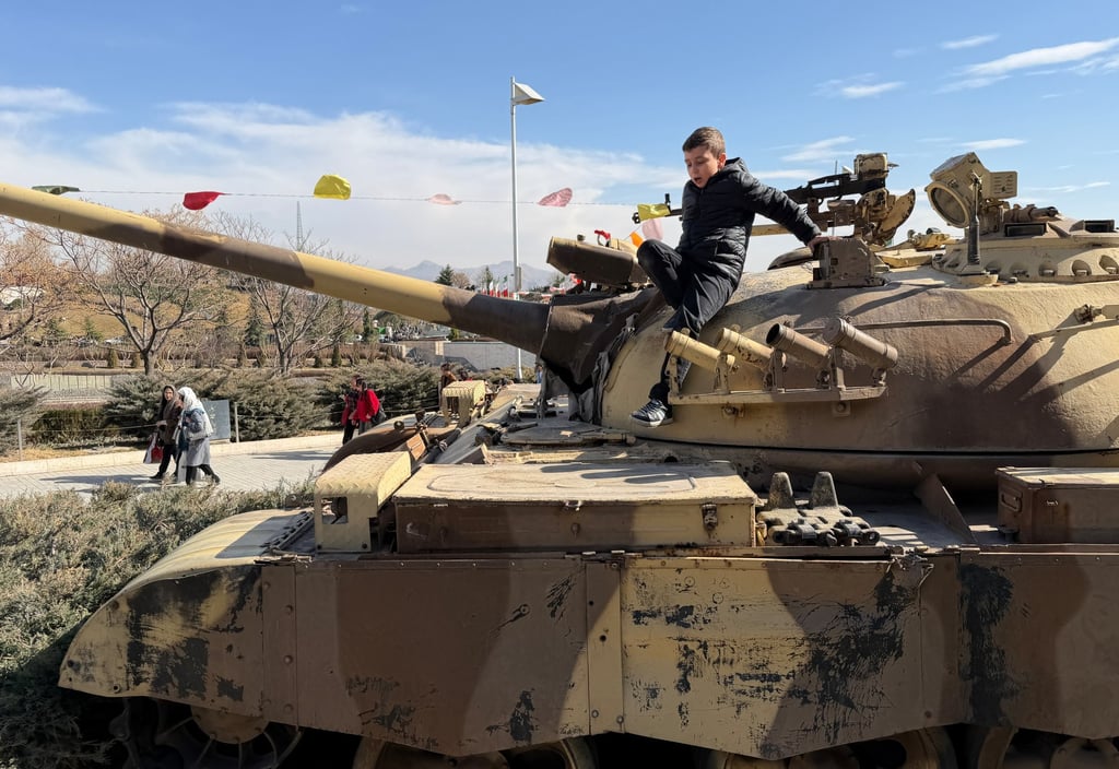 A boy plays on a tank displayed at the Islamic Revolution and Holy Defence Museum in Tehran on Friday. Photo: AP