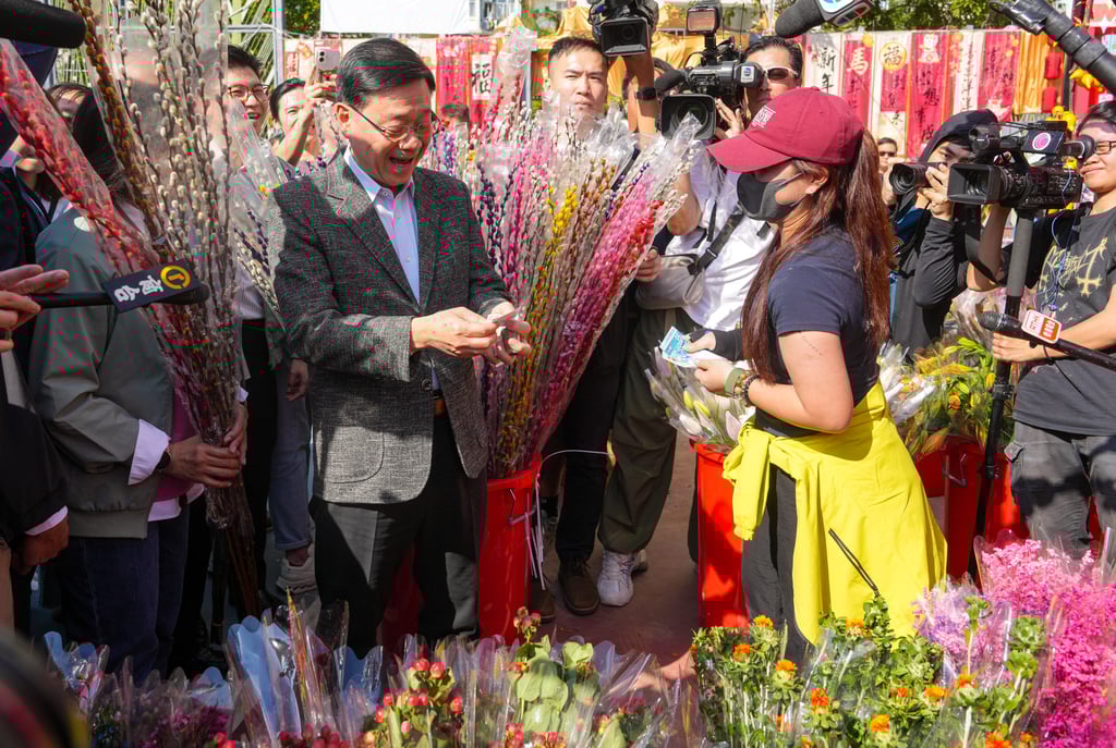 John Lee visits the Lunar New Year fair at Kwun Tong Recreation Ground. Photo: Sam Tsang John Lee visits the Lunar New Year fair at Kwun Tong Recreation Ground. Photo: Sam Tsang