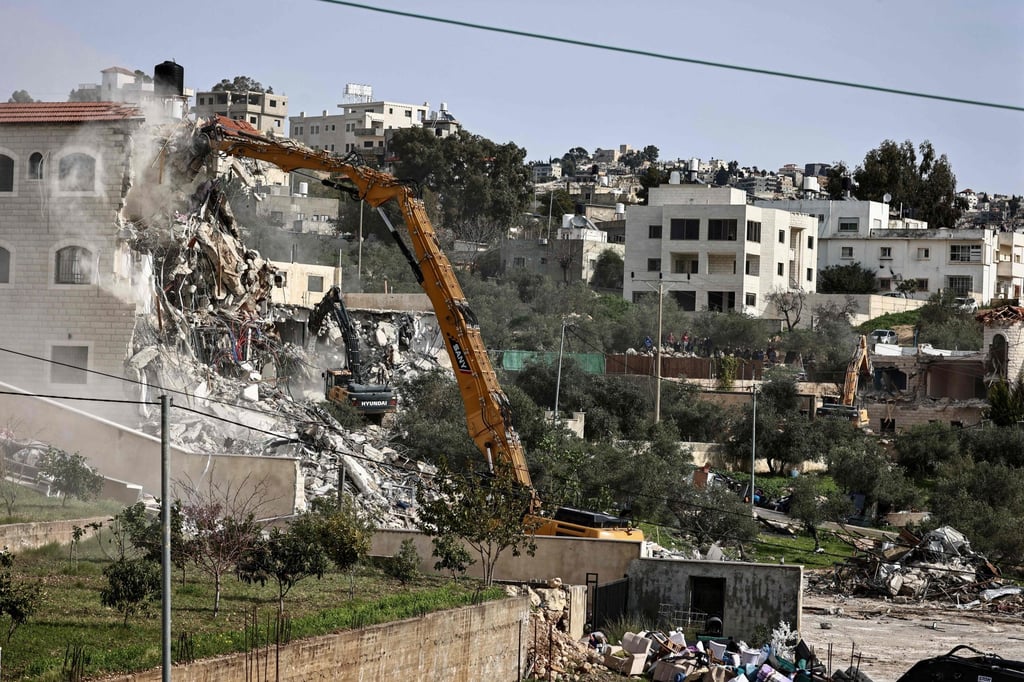 Israeli military bulldozers demolish three Palestinian-owned houses in Shuqba village, west of the administrative city of Ramallah, in Israeli-occupied West Bank. Photo: AFP Israeli military bulldozers demolish three Palestinian-owned houses in Shuqba village, west of the administrative city of Ramallah, in Israeli-occupied West Bank. Photo: AFP