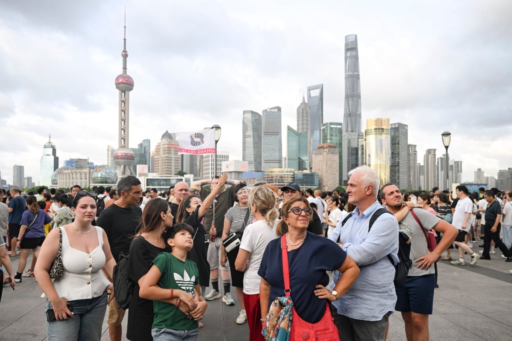 Foreign tourists take in the sights in the Bund area of Shanghai. Photo: Xinhua Foreign tourists take in the sights in the Bund area of Shanghai. Photo: Xinhua