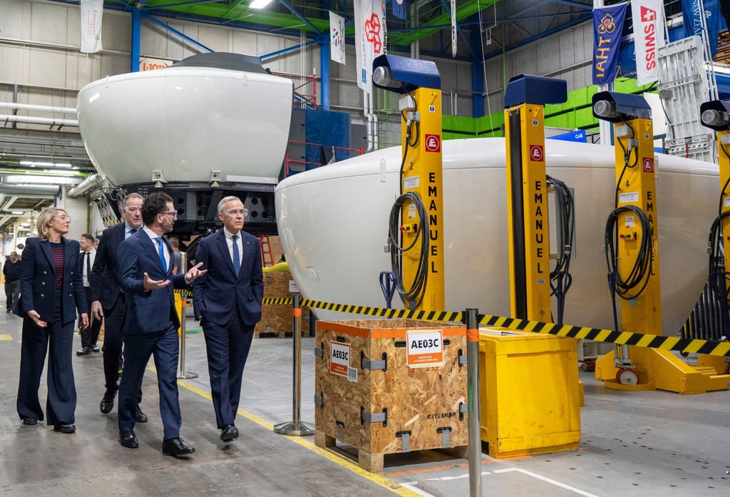 Prime Minister Mark Carney (right) tours CAE Inc facilities in Montreal on Tuesday. Photo: The Canadian Press via AP Prime Minister Mark Carney (right) tours CAE Inc facilities in Montreal on Tuesday. Photo: The Canadian Press via AP