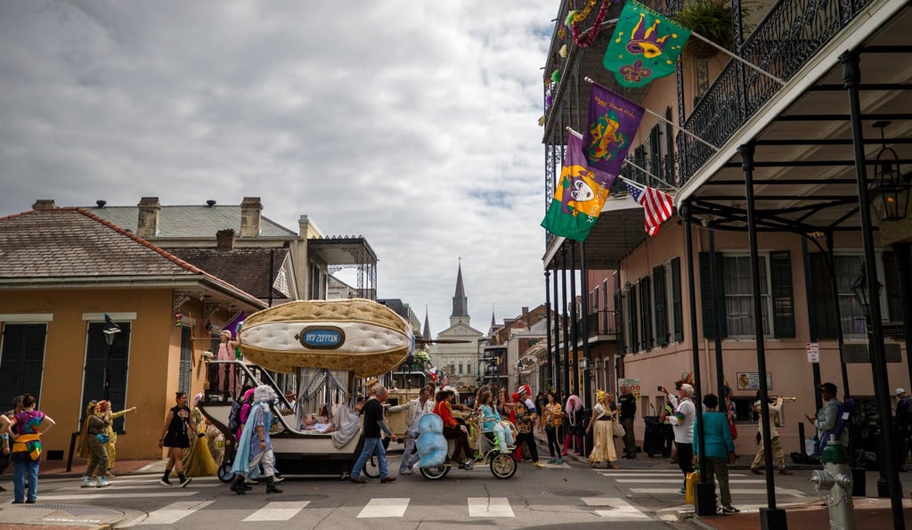 Mardi Gras revellers parade through the New Orleans French Quarter on Tuesday. Photo: AP Mardi Gras revellers parade through the New Orleans French Quarter on Tuesday. Photo: AP