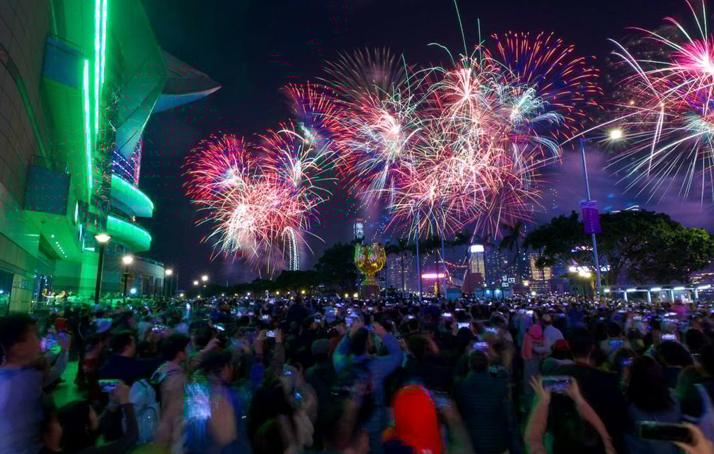 Crowds gather at Golden Bauhinia Square in Wan Chai for the show. Photo: Eugene Lee