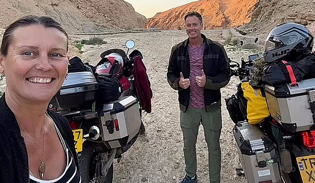 Craig and Lindsay Foreman pause for a picture during their round-the-world motorcycle tour. Photo: Foreman family / AFP