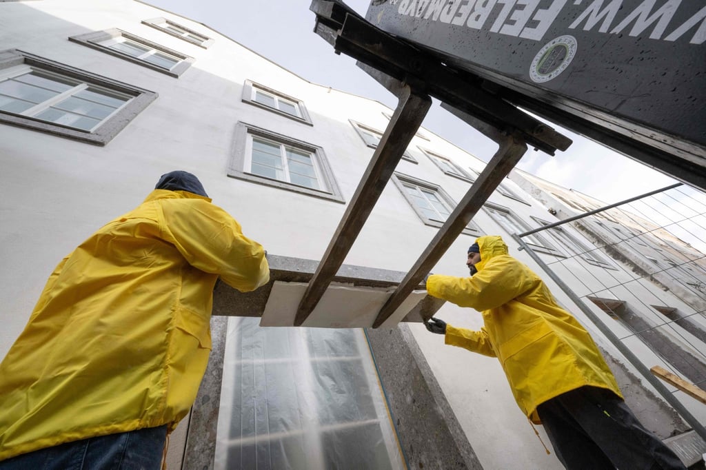 Workers put the finishing touches to the new police station in Braunau am Inn, Austria. Photo: AFP