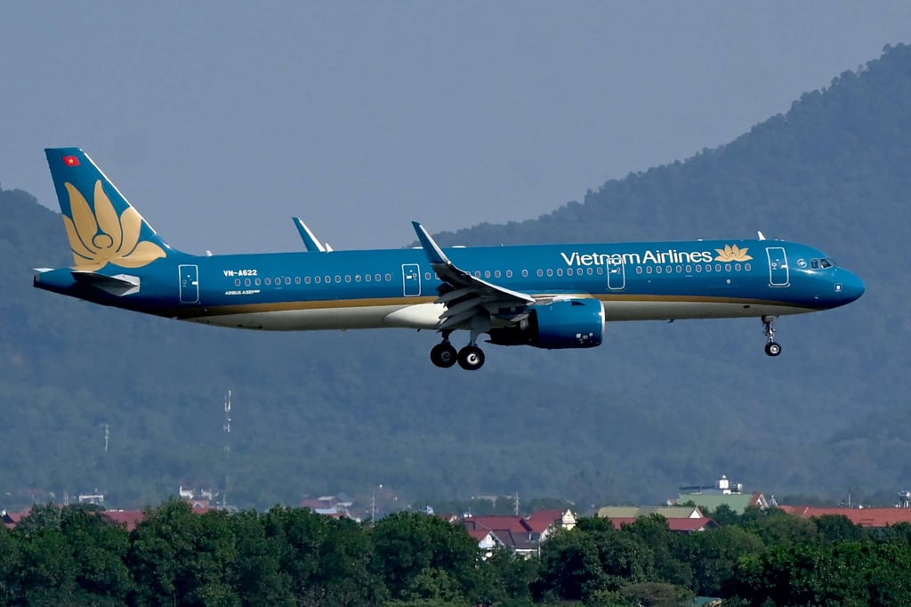 A Vietnam Airlines aircraft lands at Noi Bai International Airport in Hanoi. The Vietnamese national carrier placed an US$8.1 billion order with Boeing this week. Photo: AFP A Vietnam Airlines aircraft lands at Noi Bai International Airport in Hanoi. The Vietnamese national carrier placed an US$8.1 billion order with Boeing this week. Photo: AFP