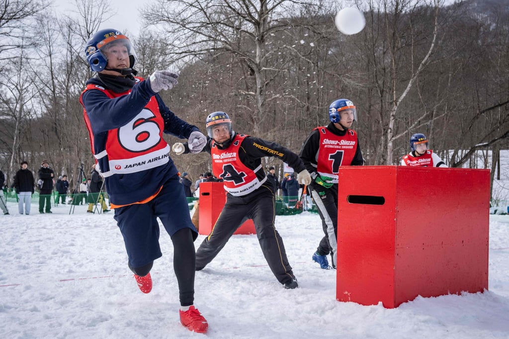 Players throwing snowballs during the Showa-shinzan competition on Saturday. Photo: AFP