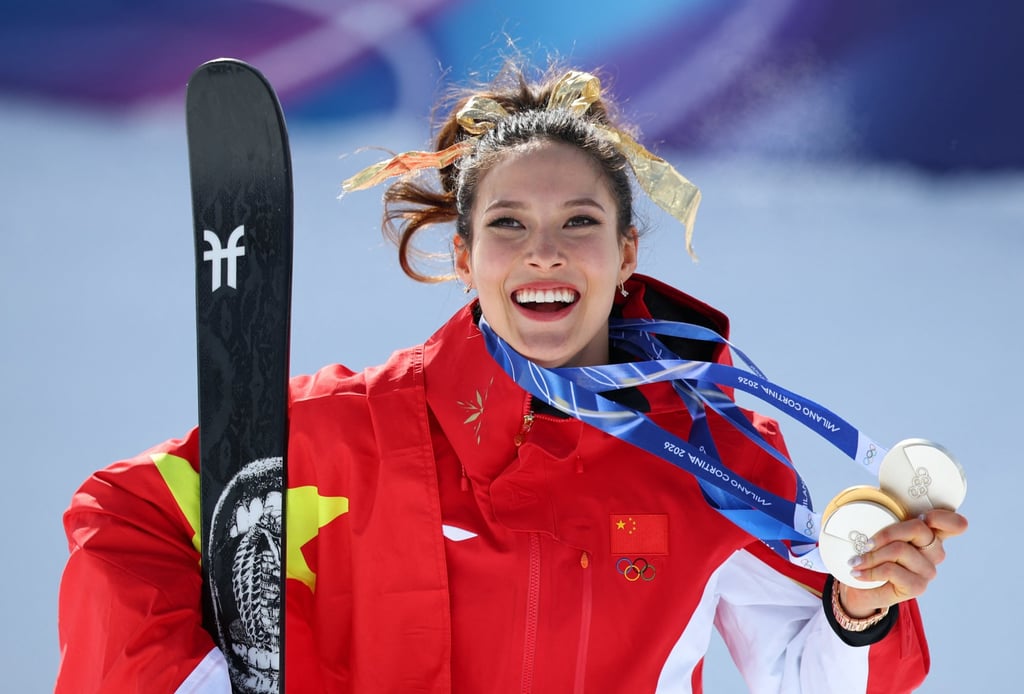 Eileen Gu of China holding her three medals from the Milano Cortina Olympics. Photo: Reuters