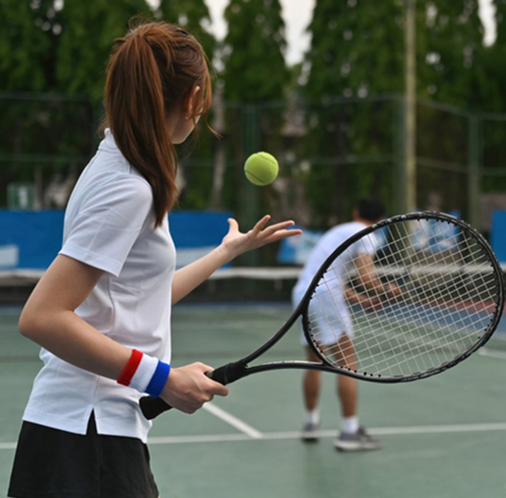A Chinese woman prepares to serve during a tennis match. So-called boot camps involving the sport are growing in popularity. Photo: Zhihu