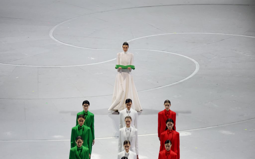 Model Vittoria Ceretti carries the Italian flag during the opening ceremony. Photo: Reuters Model Vittoria Ceretti carries the Italian flag during the opening ceremony. Photo: Reuters