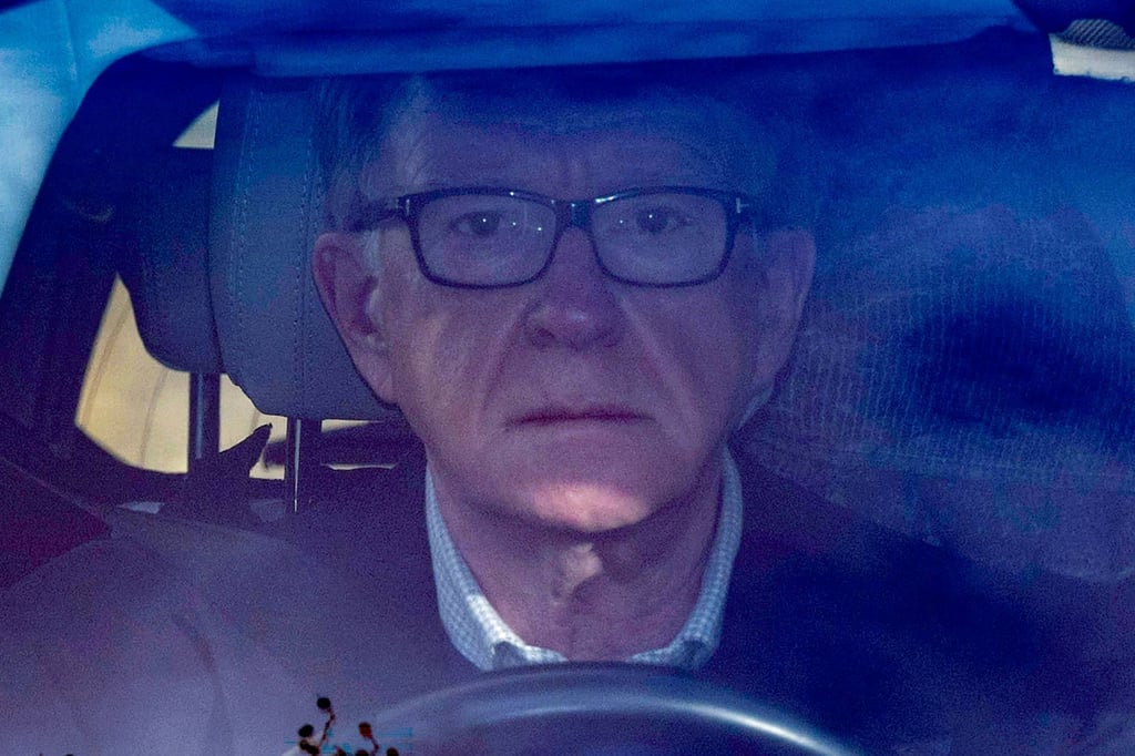 Peter Mandelson drives away from his London residence on February 14. Photo: AFP