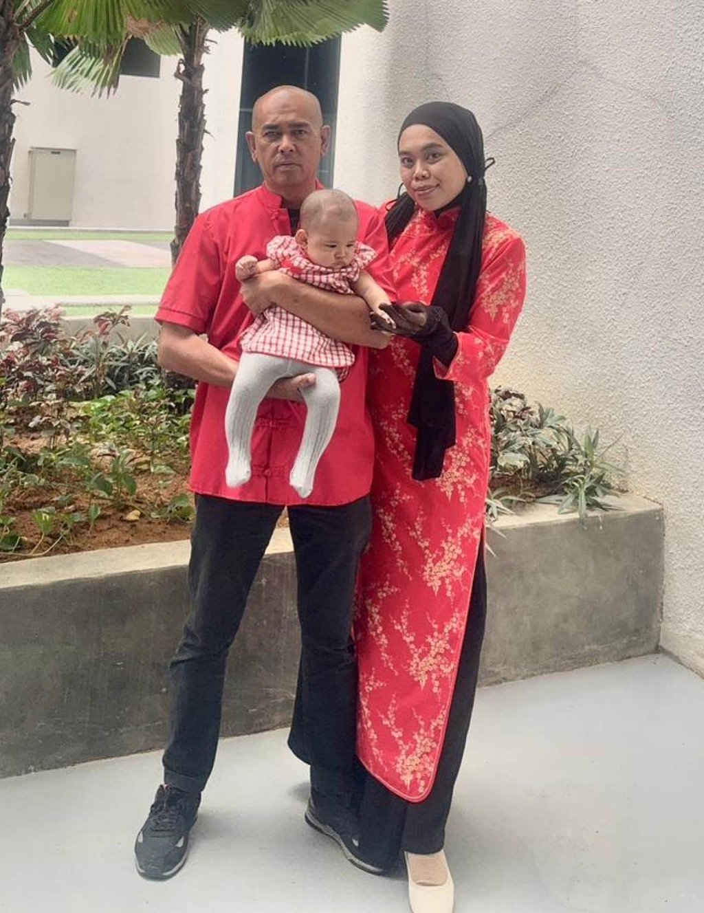 Syazni Nabilah Che Kamarudin, her husband and their five-month-old daughter don traditional Chinese attire for Lunar New Year celebrations. Photo: Syazni Nabilah Che Kamarudin