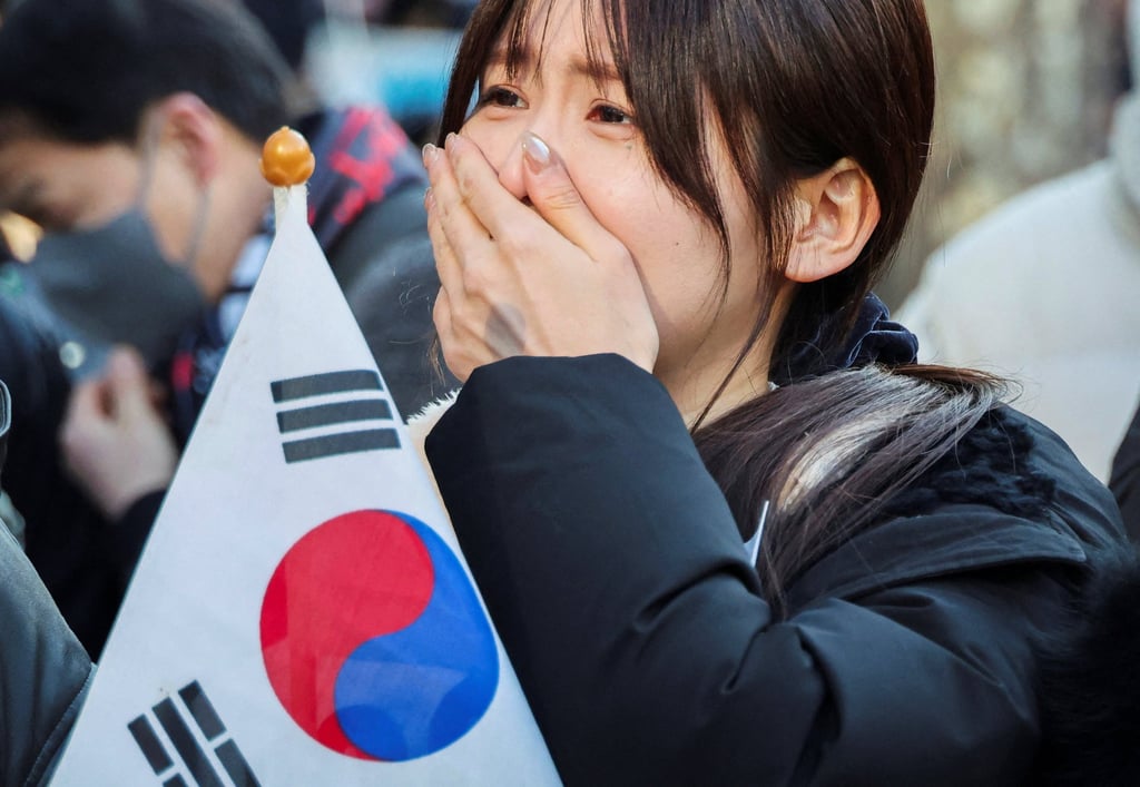A Yoon supporter reacts following a guilty verdict during the sentencing trial in his insurrection case on February 19. Photo: Reuters A Yoon supporter reacts following a guilty verdict during the sentencing trial in his insurrection case on February 19. Photo: Reuters
