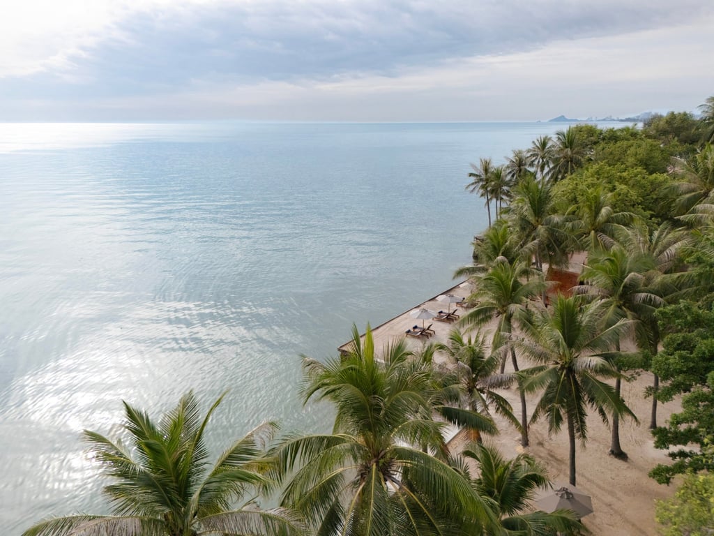 The beach at Anantara Hua Hin Resort is surrounded by palm trees. Photo: Handout The beach at Anantara Hua Hin Resort is surrounded by palm trees. Photo: Handout