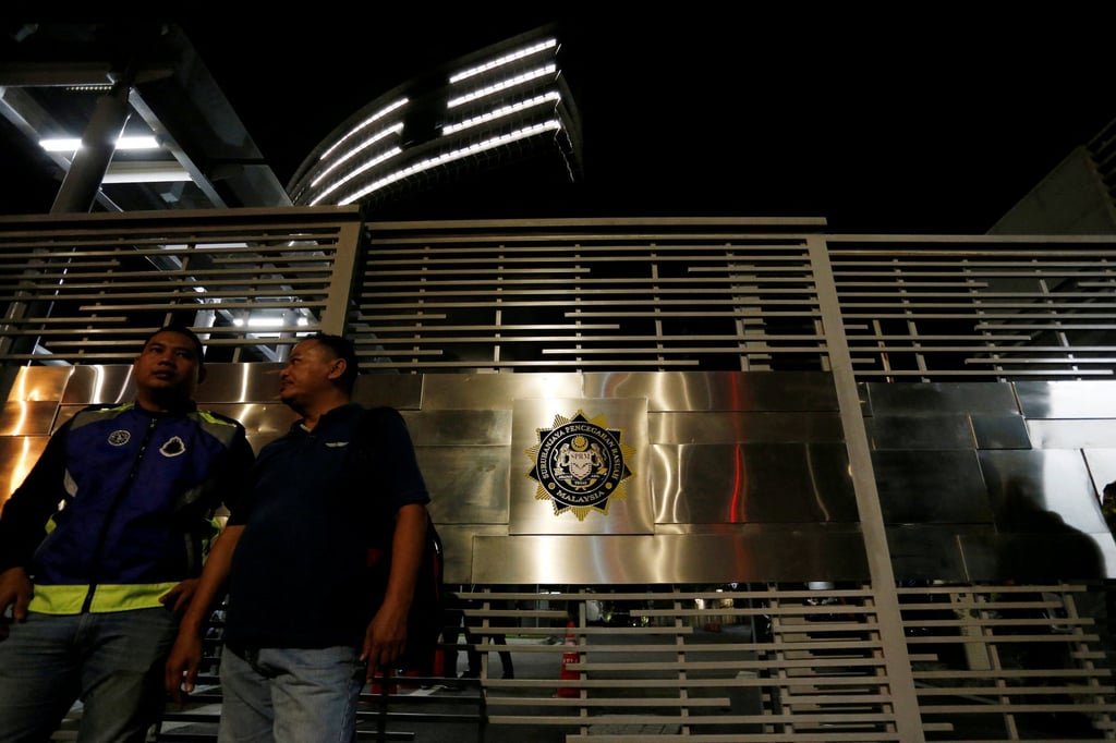 Police officers stand guard outside the Malaysian Anti-Corruption Commission (MACC) headquarters in Putrajaya, Malaysia, in 2018. Photo: Reuters Police officers stand guard outside the Malaysian Anti-Corruption Commission (MACC) headquarters in Putrajaya, Malaysia, in 2018. Photo: Reuters